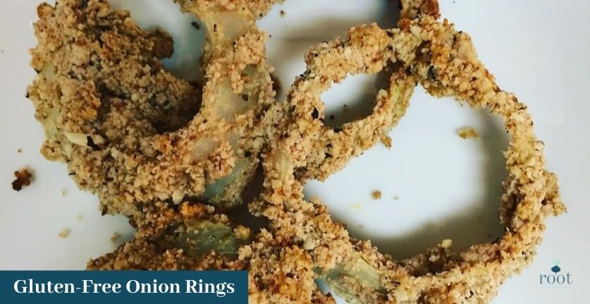 Almond crusted gluten free onion rings on a white plate | Root Nutrition Education and Counseling